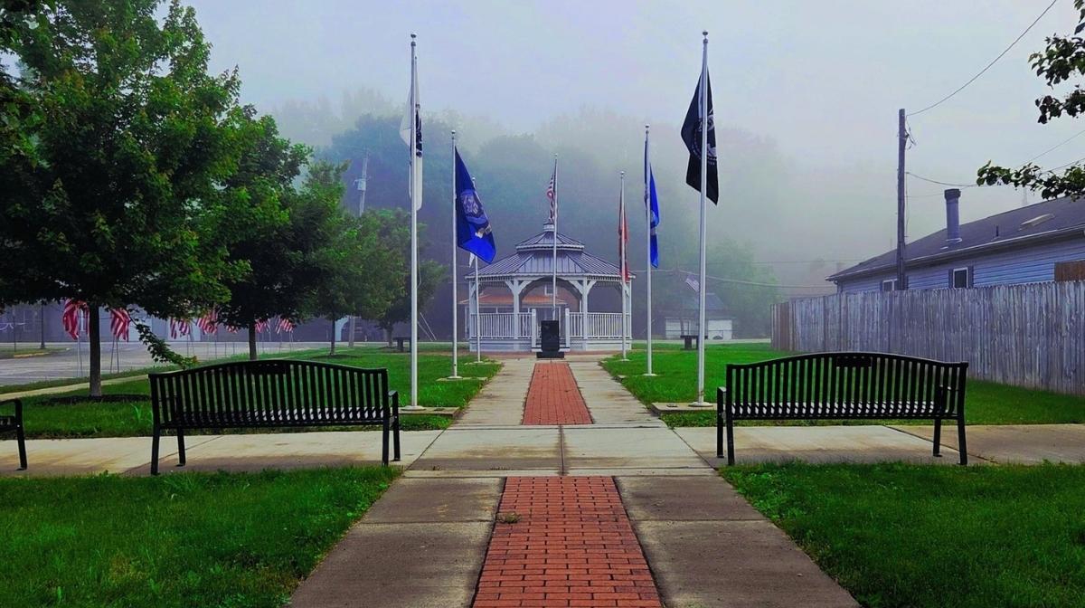Foggy morning at a veterans memorial park with flags and a gazebo in Lockbourne, Ohio